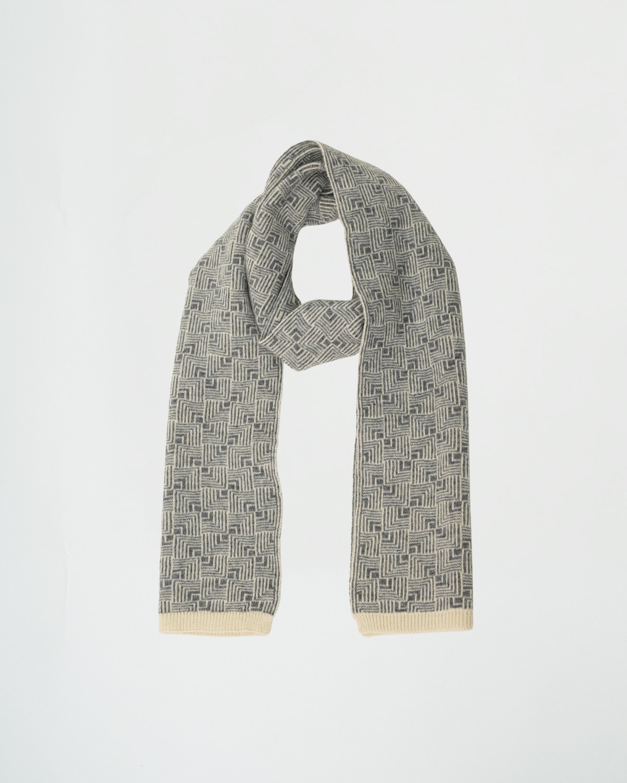 Gray patterned scarf with a beige trim on a white background