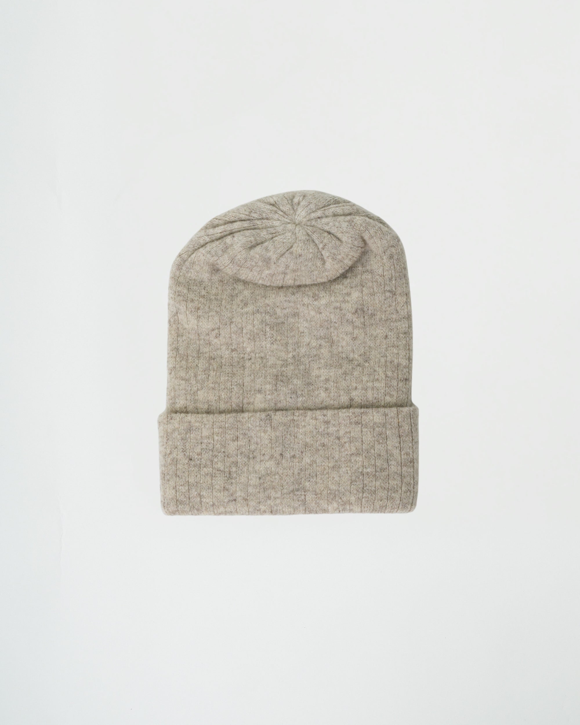 Beige knit beanie on a light gray background