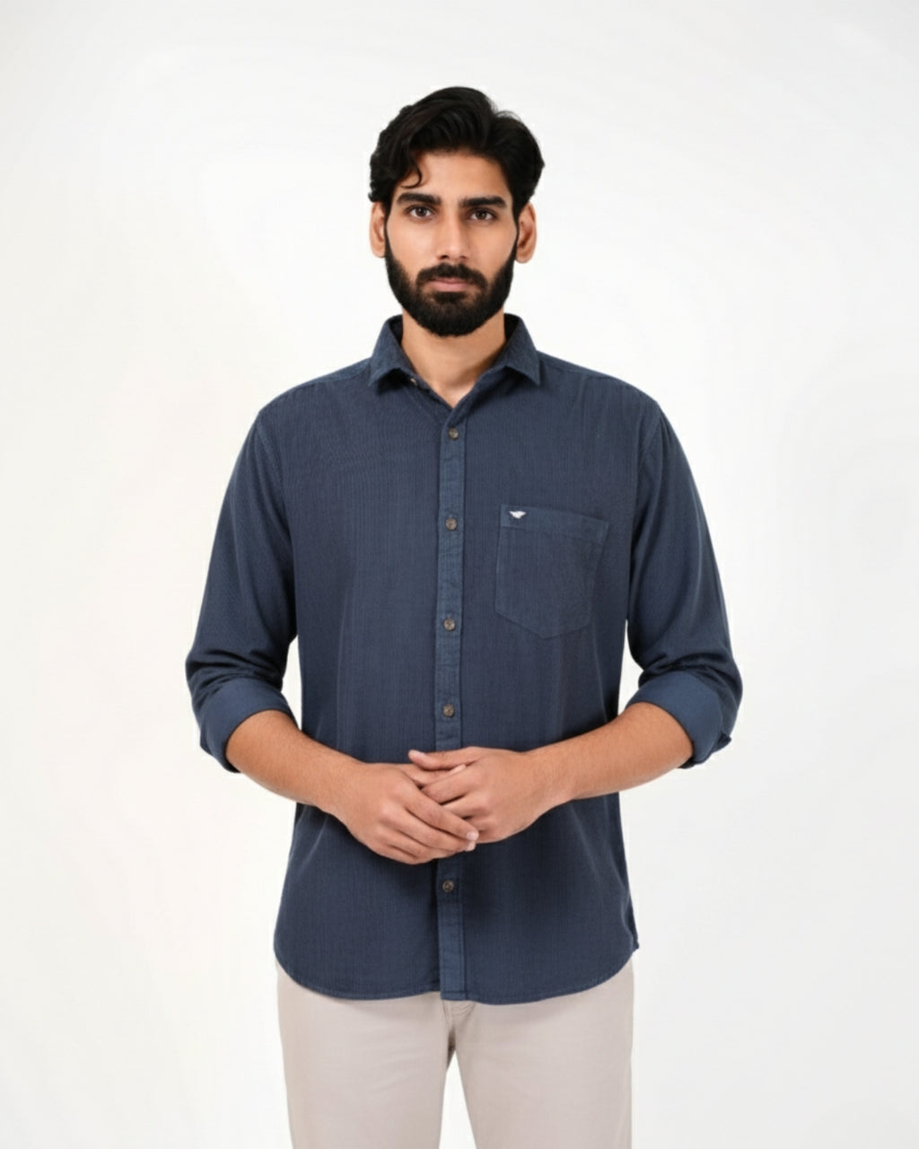 Man wearing a blue shirt on a white background