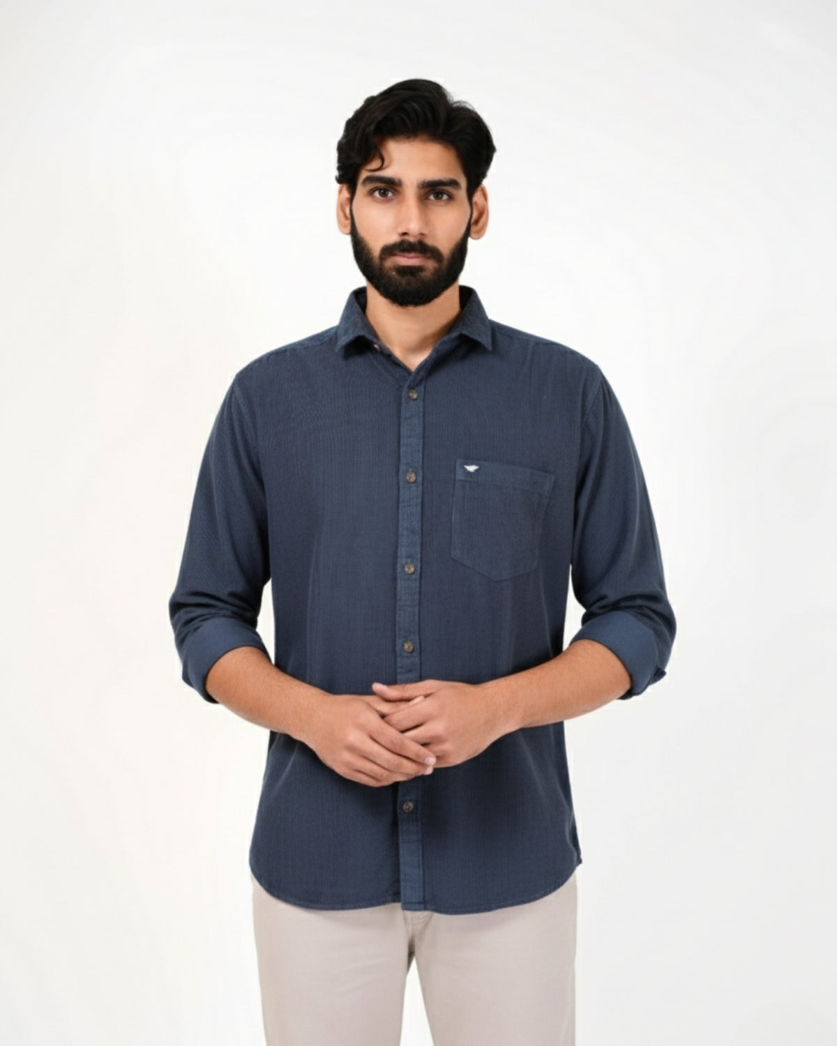 Man wearing a blue shirt on a white background