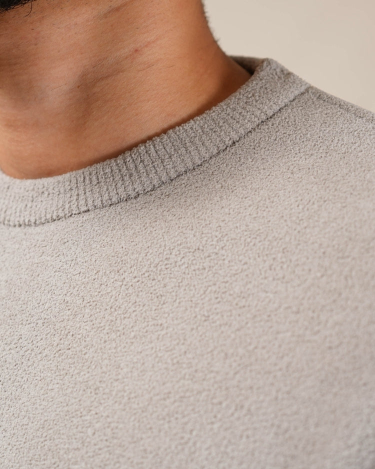 Close-up of a textured gray sweater