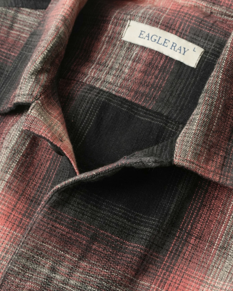 Close-up of a plaid shirt with 'Eagle Ray' label