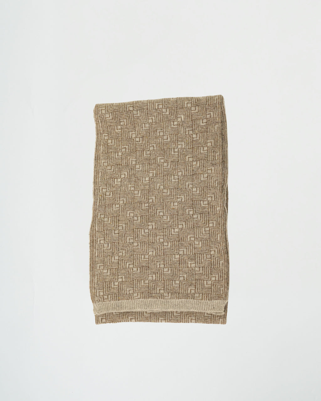Textured fabric with geometric pattern on a white background