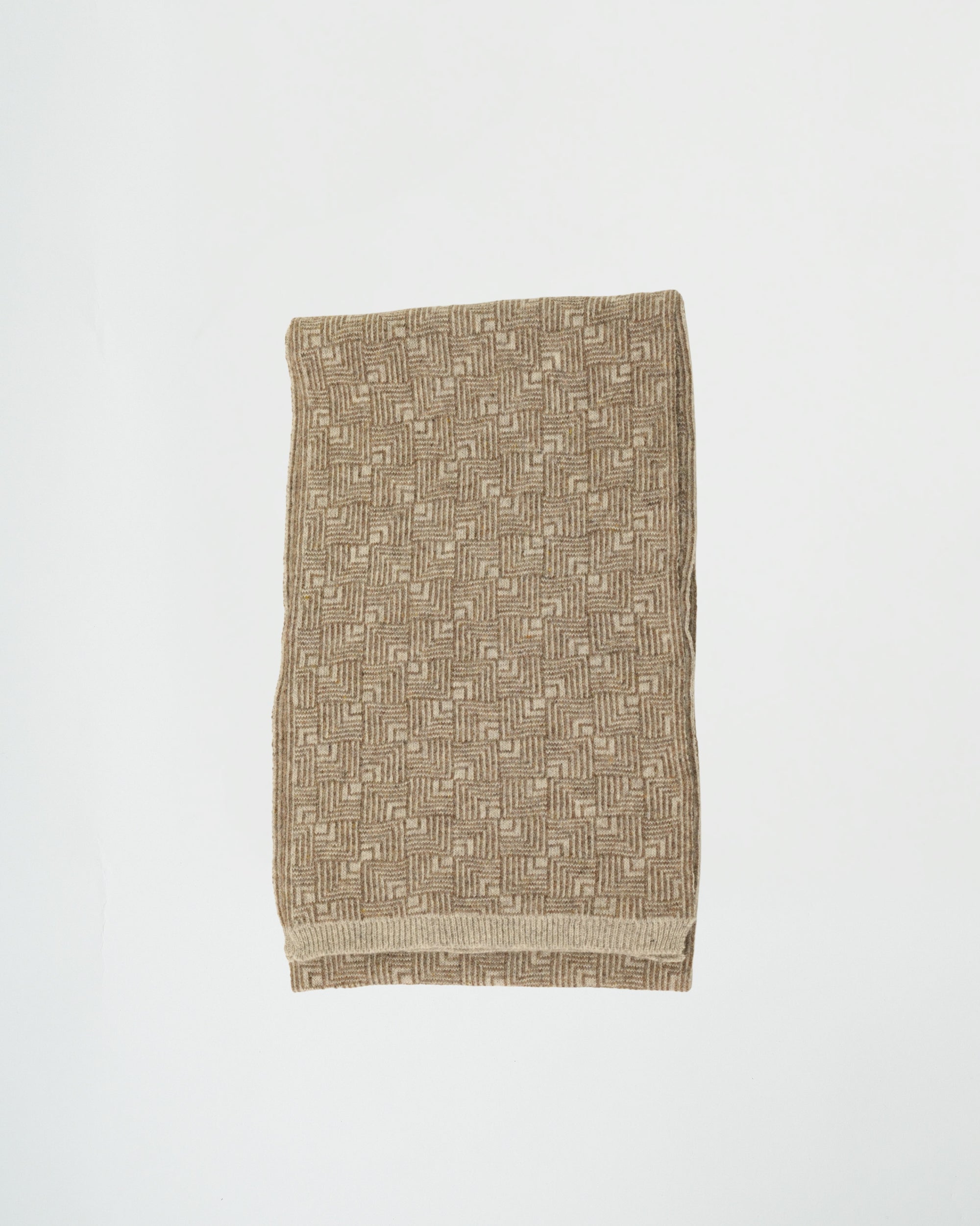 Textured fabric with geometric pattern on a white background