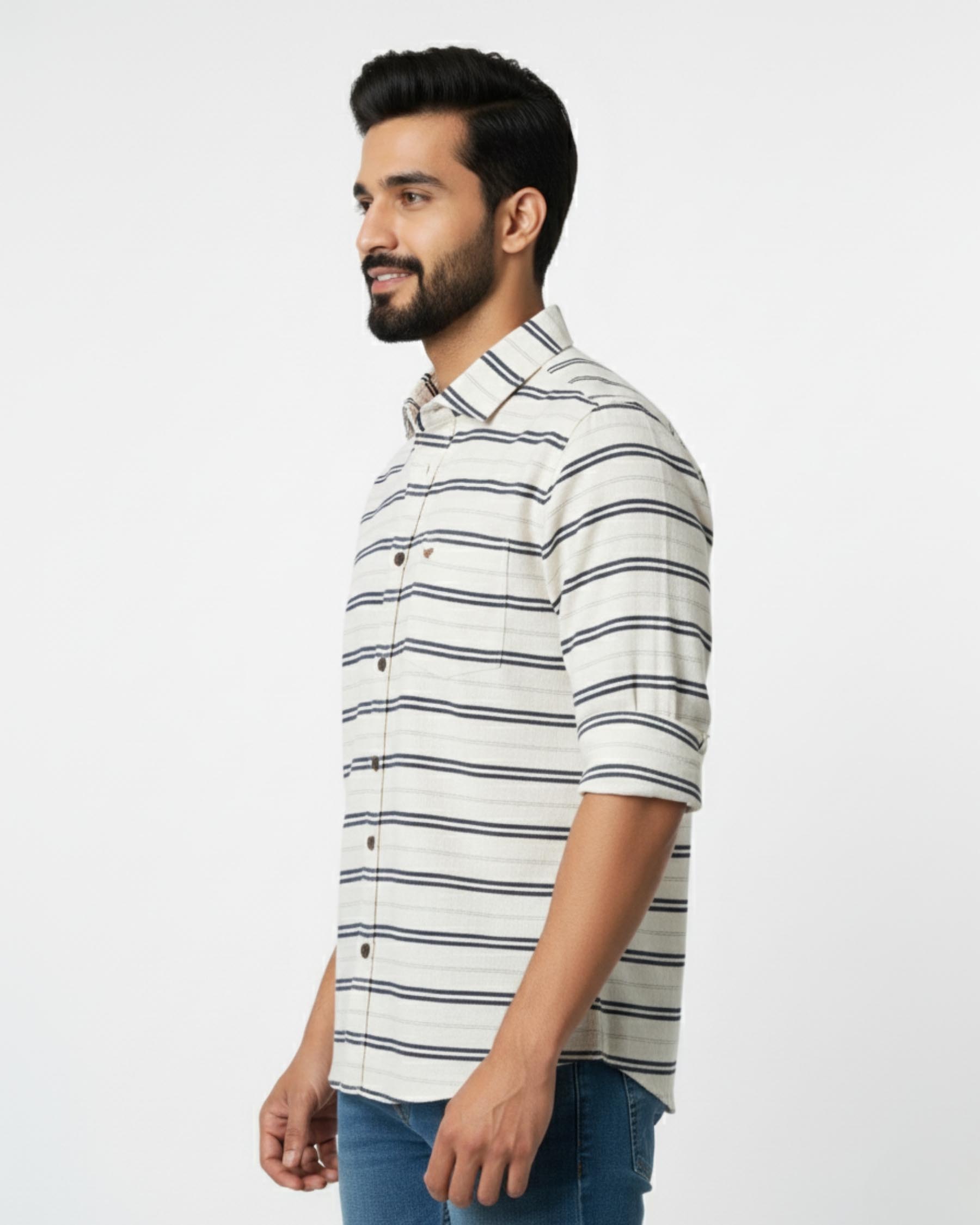 Man wearing a white and black striped shirt on a white background