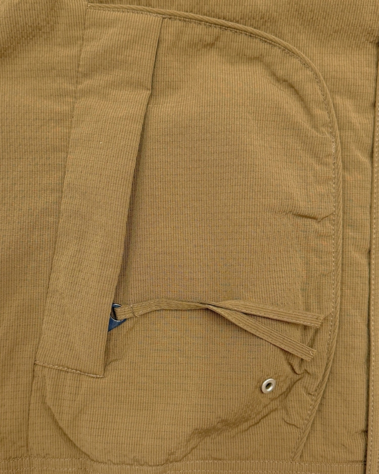 Close-up of a brown corduroy jacket with a pocket