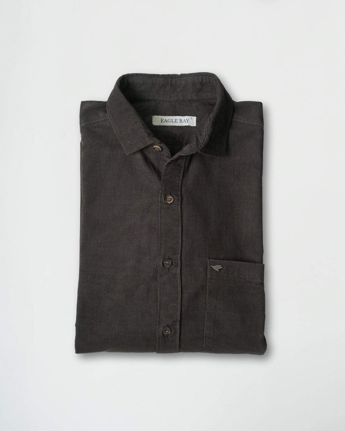 Folded dark gray shirt with brand label on a light gray background