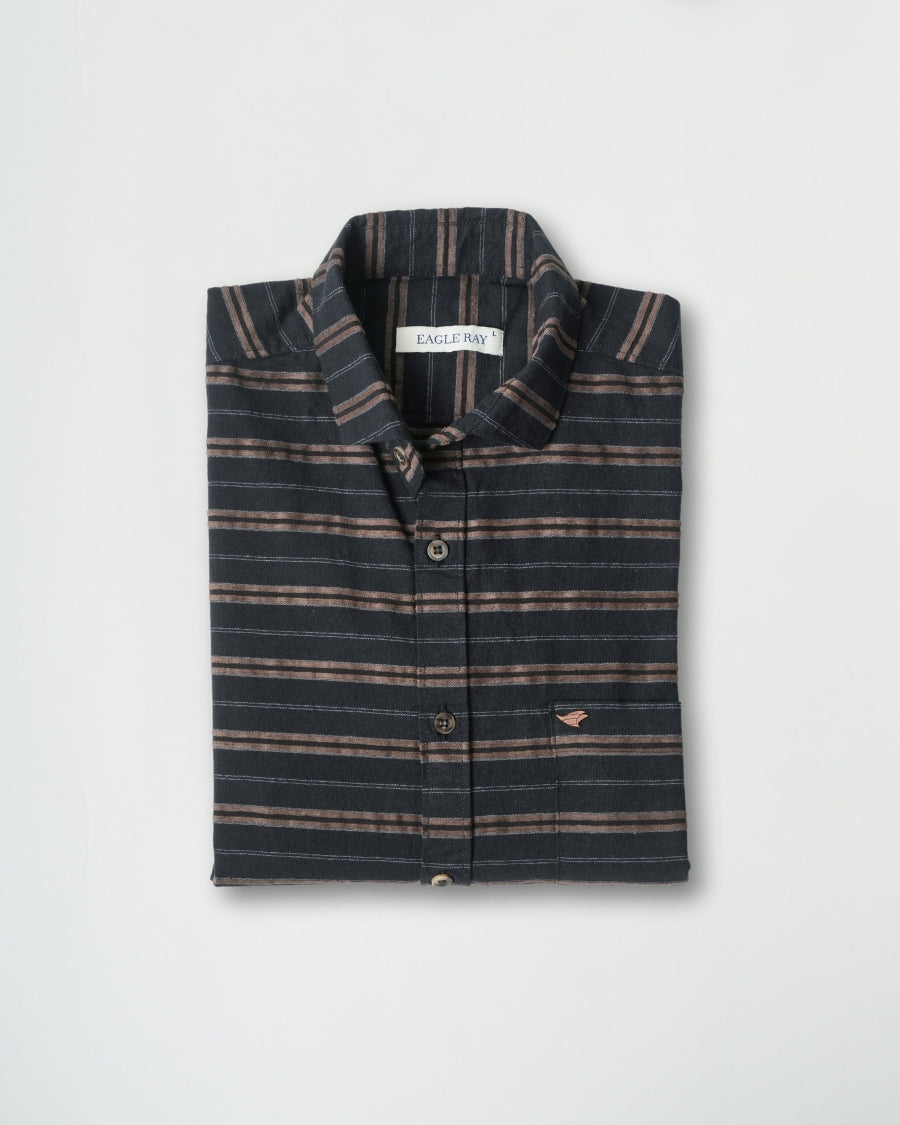 Folded striped shirt on a light gray background