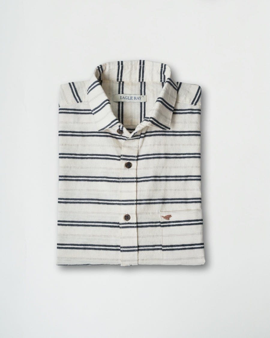 Folded striped shirt with brand logo on a light gray background