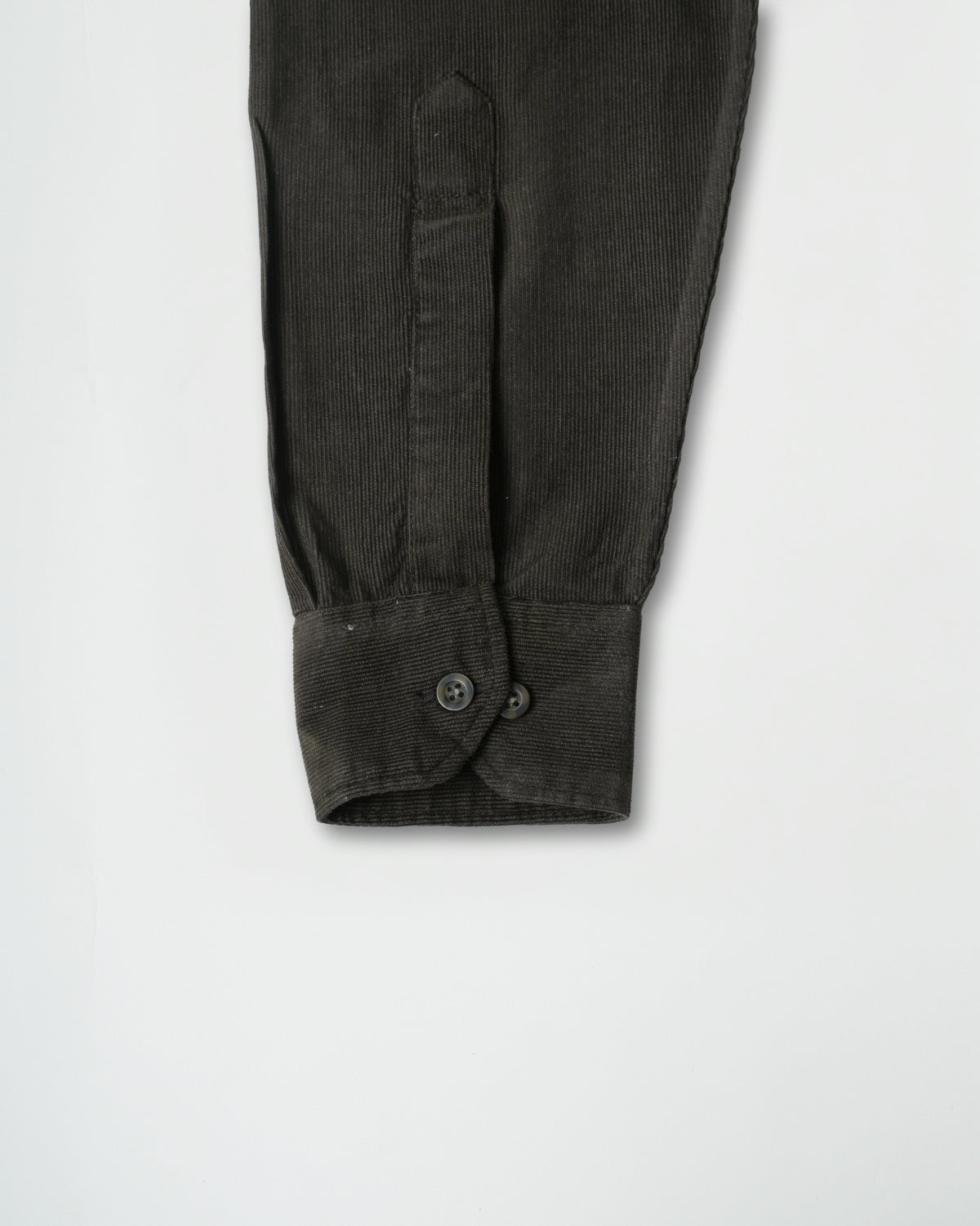 Dark ribbed knit sleeve on a white background