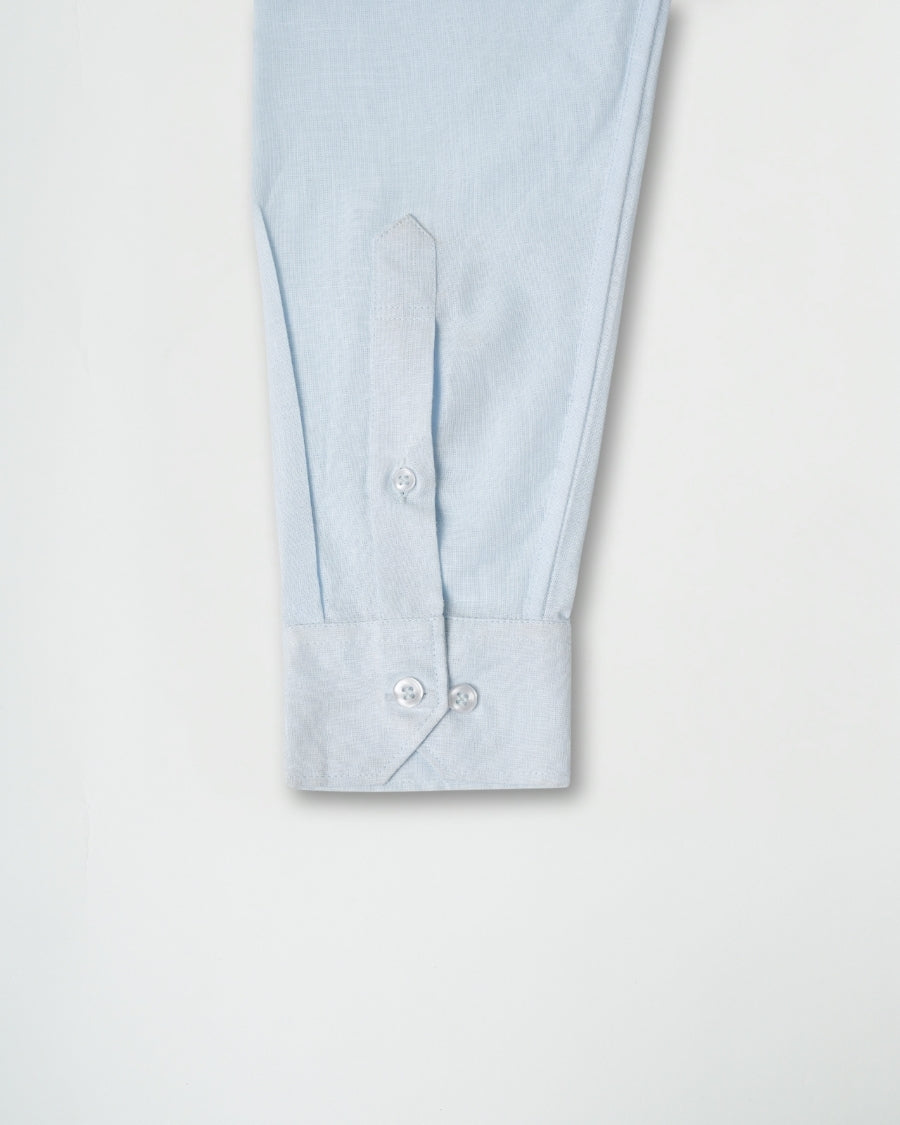 Light blue shirt sleeve with buttons on a white background