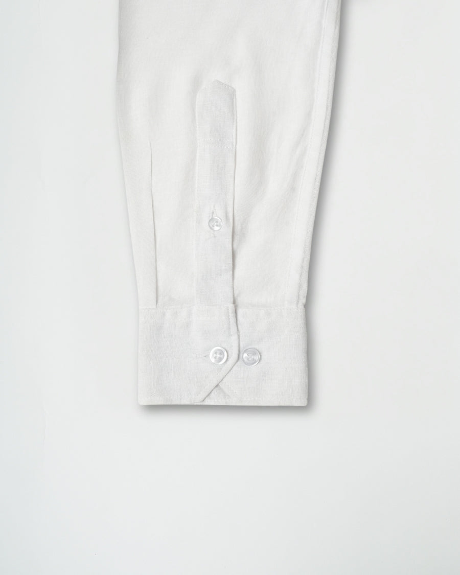 White shirt with buttons on a light gray background