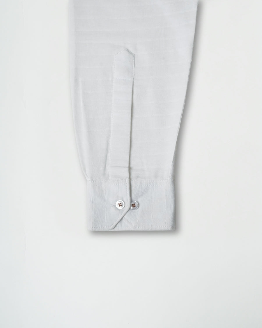 Light gray shirt sleeve with a button on a white background