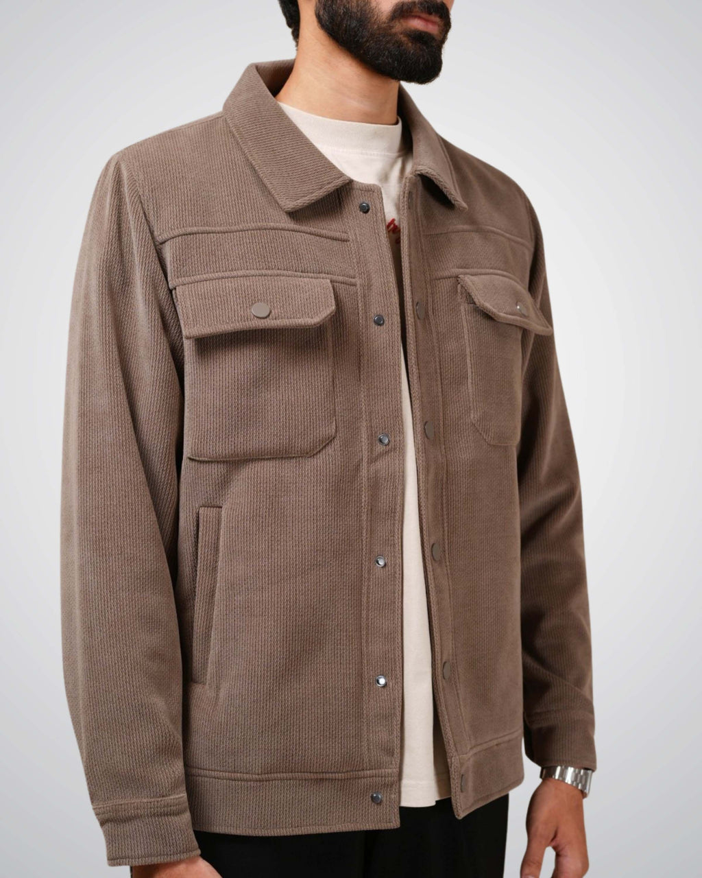 Brown jacket worn by a person on a white background