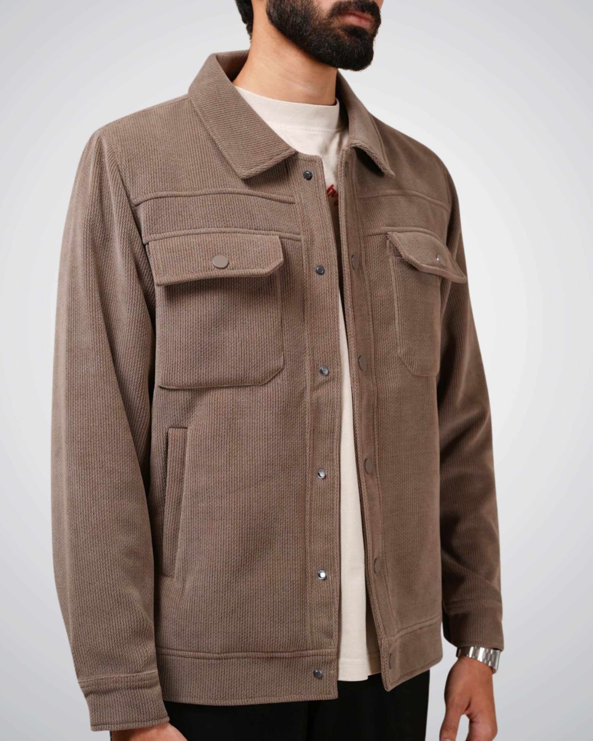 Brown jacket worn by a person on a white background